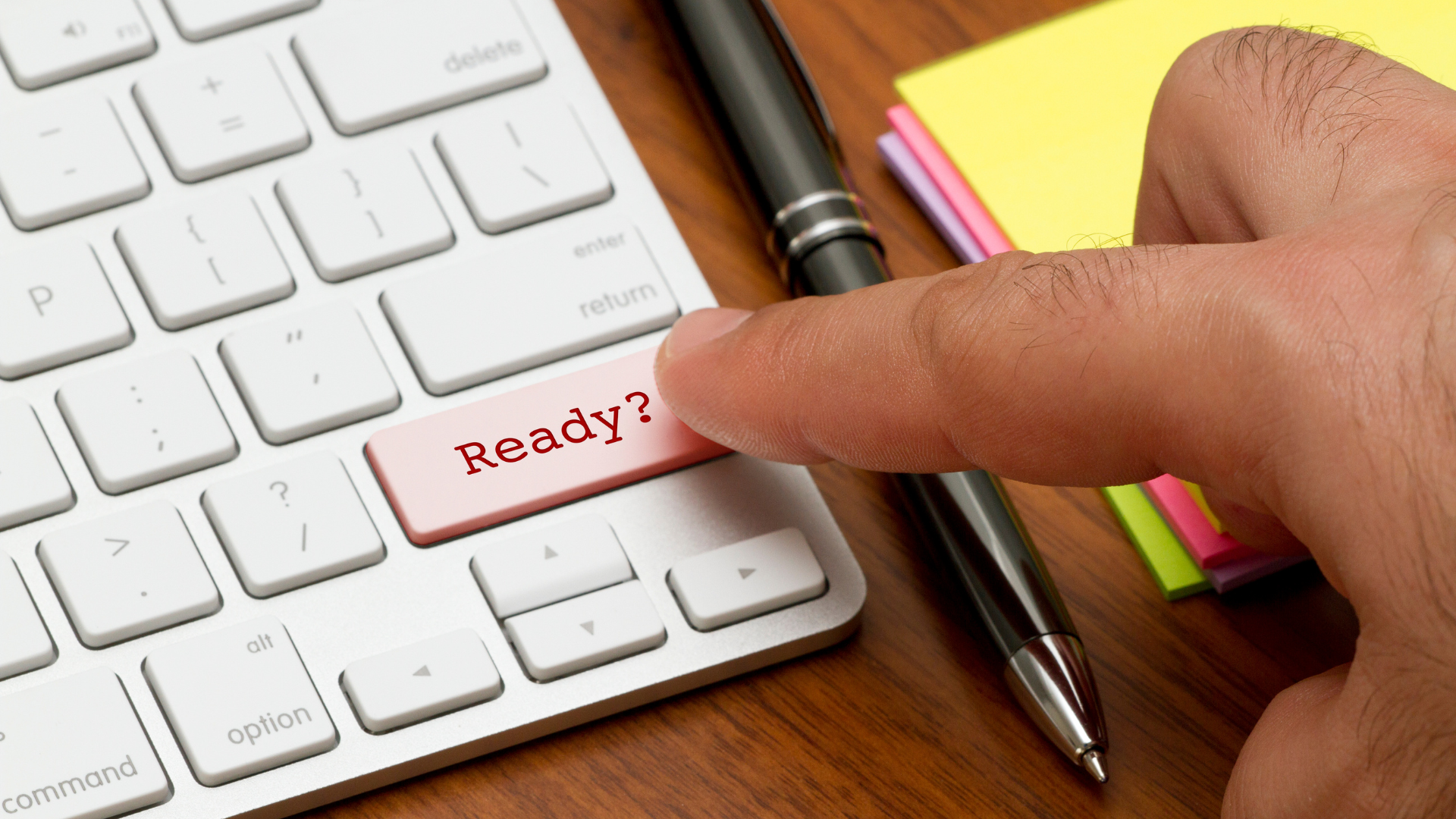 Finger pressing a keyboard key labeled “Ready?”, symbolizing a quick call to donate, sponsor, or volunteer.