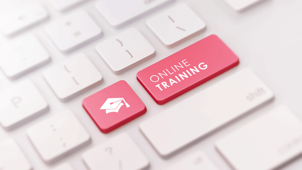 Keyboard key labeled ‘Online Training,’ representing WSU EP‑14 protection‑of‑minors training for Cougs 4 Kids mentors.